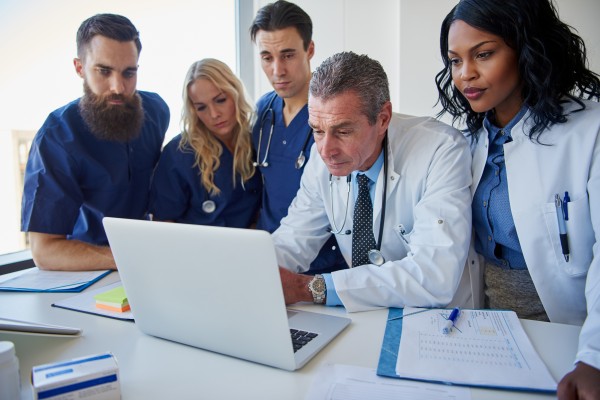 the-medicine-workers-standing-and-browsing-laptop-2021-08-26-17-26-48-utc